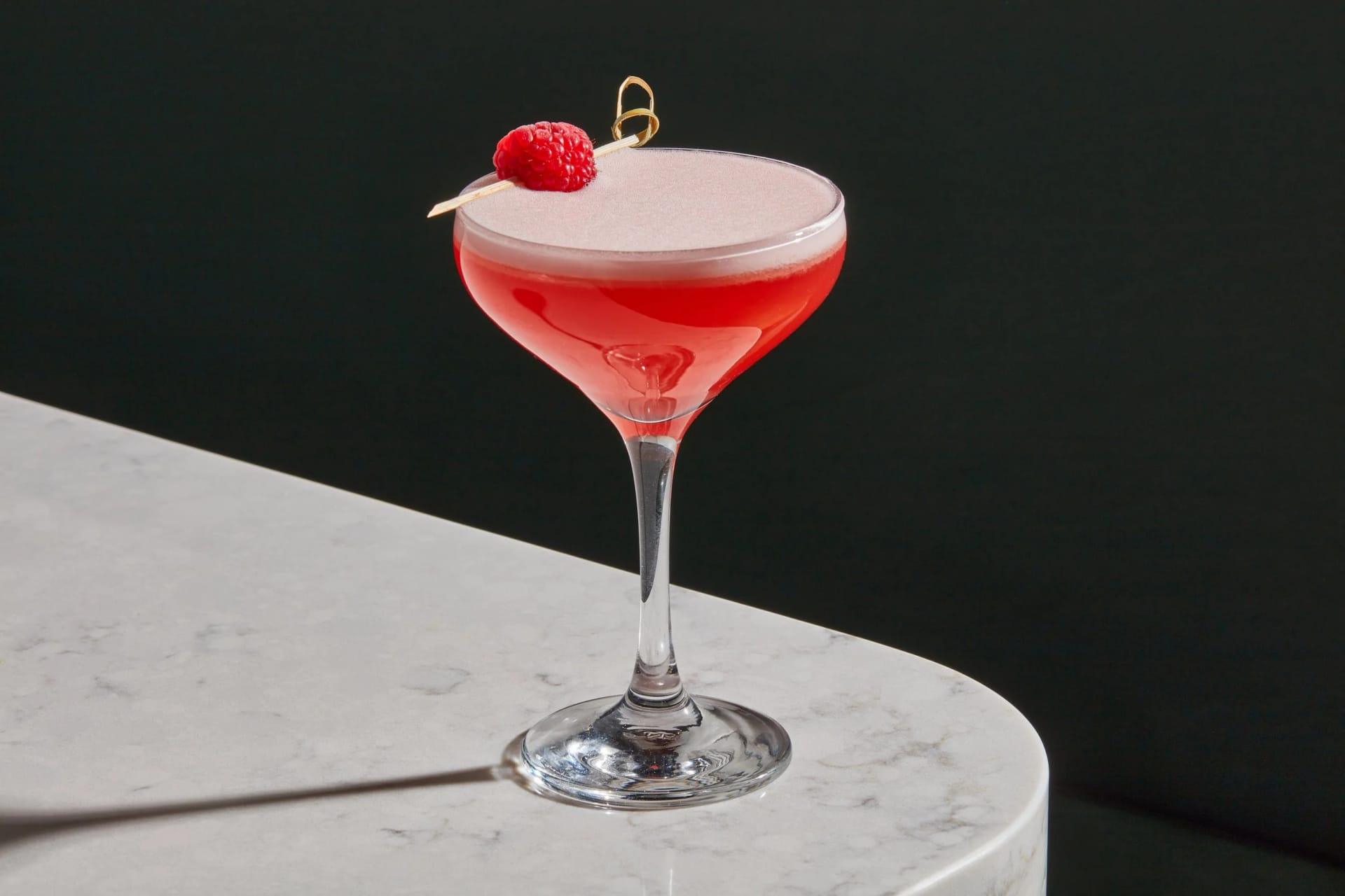 A Clover Club cocktail catching the light at the In Good Spirits bar